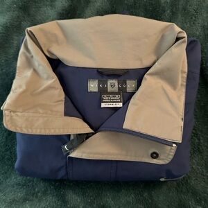 Nike Golf navy & cream windbreaker jacket.